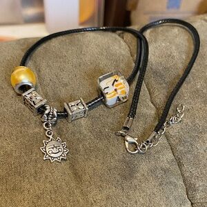 Black and Silver Charm Necklace with Yellow Beads